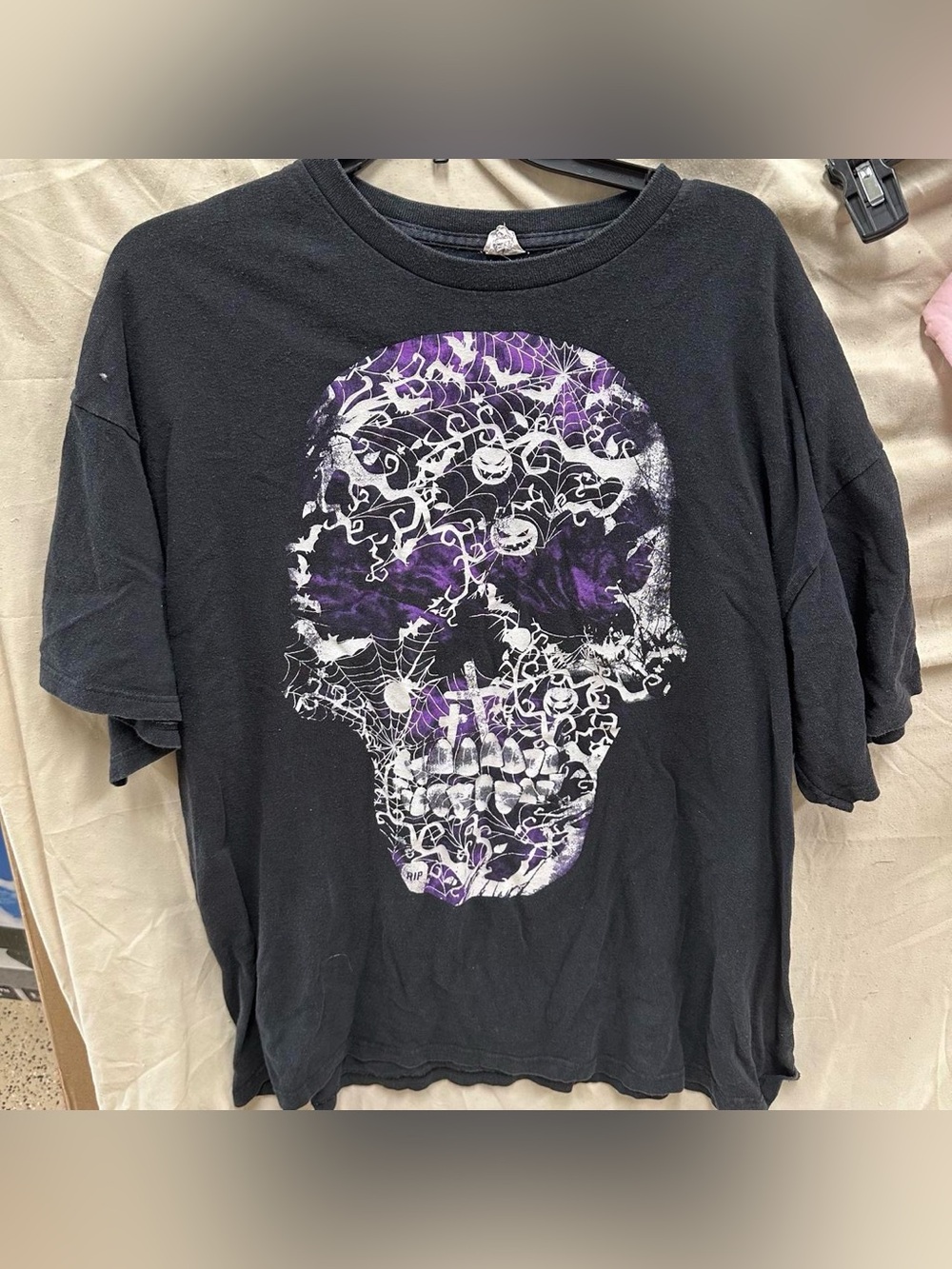 Purple, black, white graphic Halloween skull, pumpkin, bats, grave, web shirt.